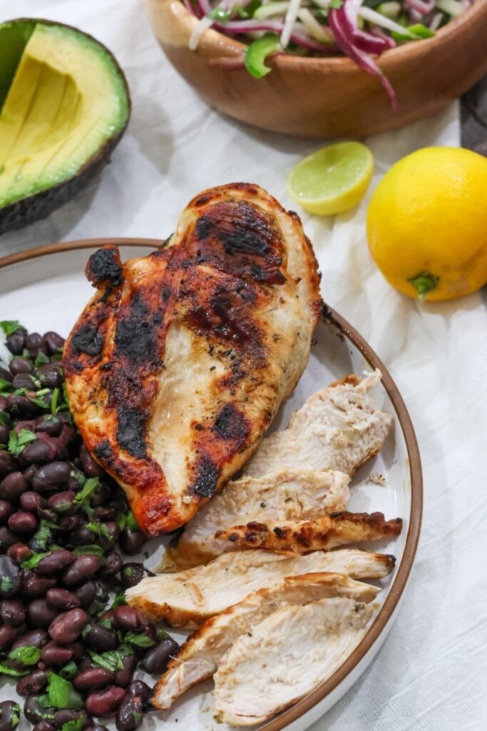grilled chicken with poblano black beans, avocado and slaw